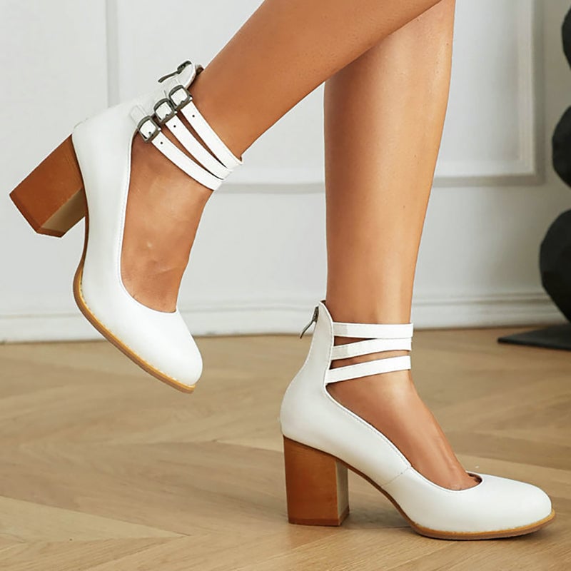 Close-up of Casilda sandal ankle strap buckle detail in brown