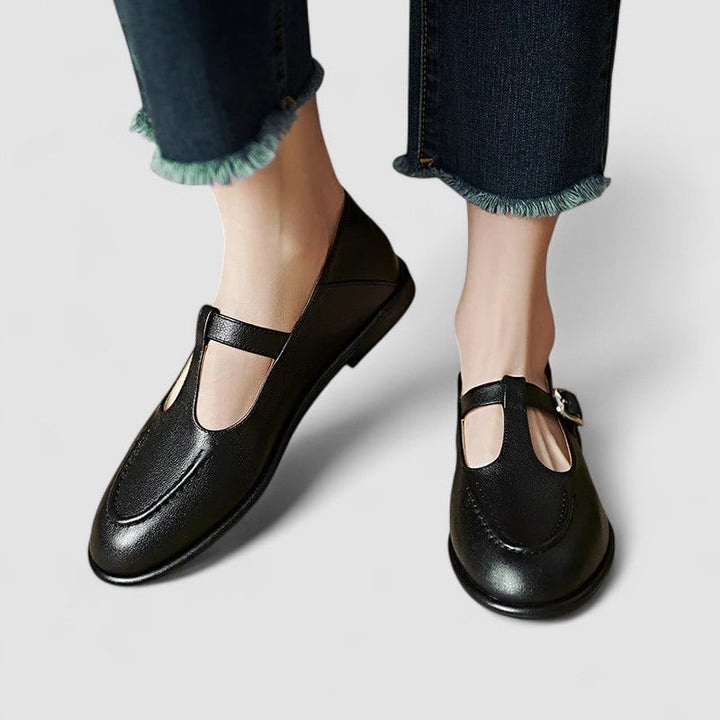 Cassandra orthopedic low heel shoe in black shown from a front three-quarter angle