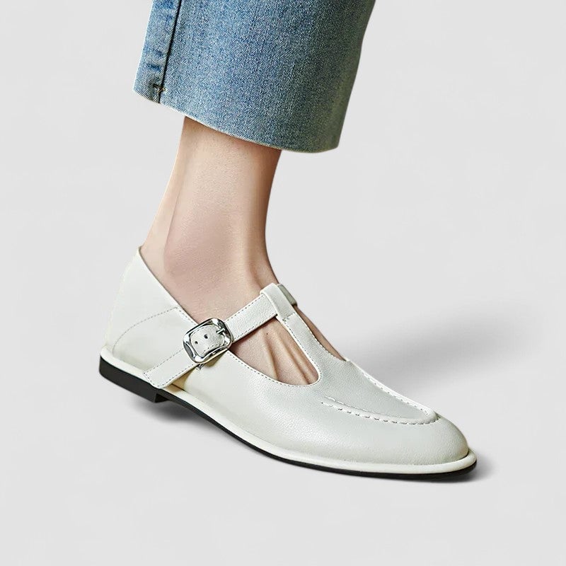 Pair of Cassandra low heel shoes in black styled with tailored trousers