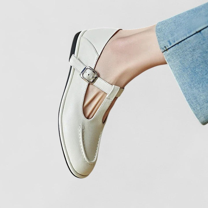 Flat lay of Cassandra orthopedic low heel shoes in both black and beige colorways