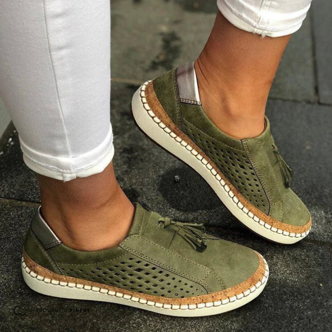 Cassandra women's orthopedic slip-on sneakers in green shown from a three-quarter front angle