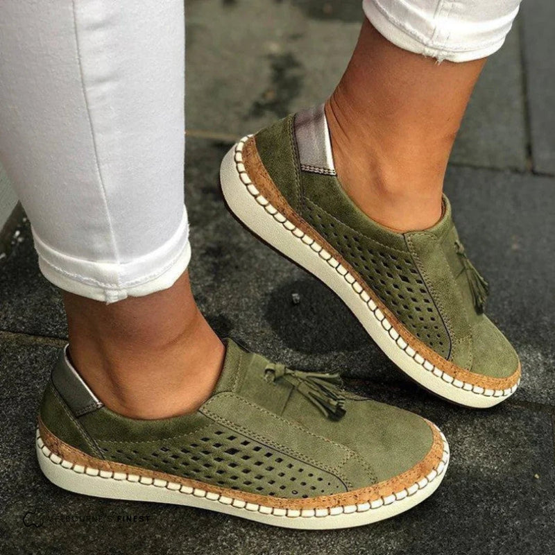 Cassandra women's orthopedic slip-on sneakers in green shown from a three-quarter front angle