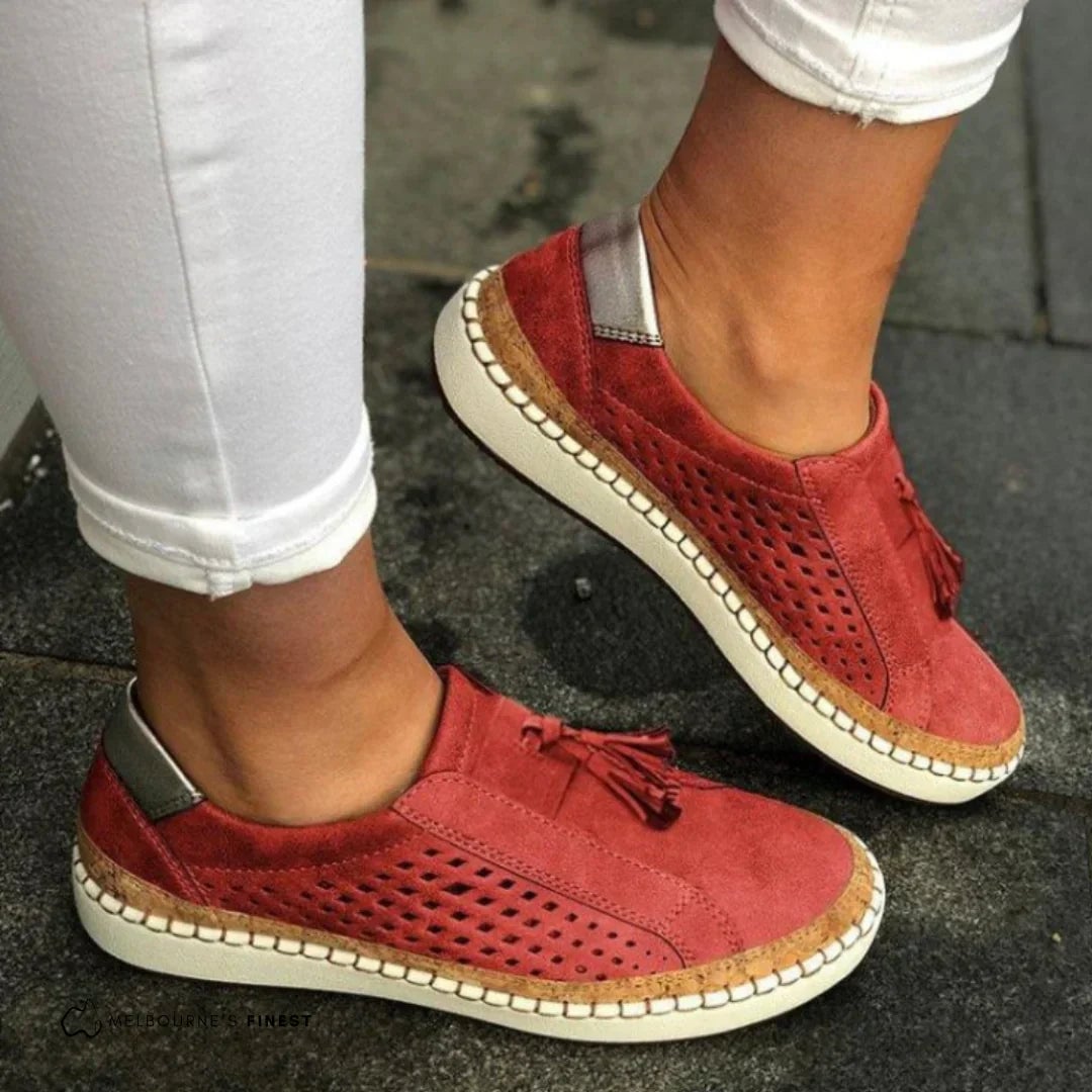 Pair of Cassandra women's slip-on sneakers displayed together showing heel and toe construction