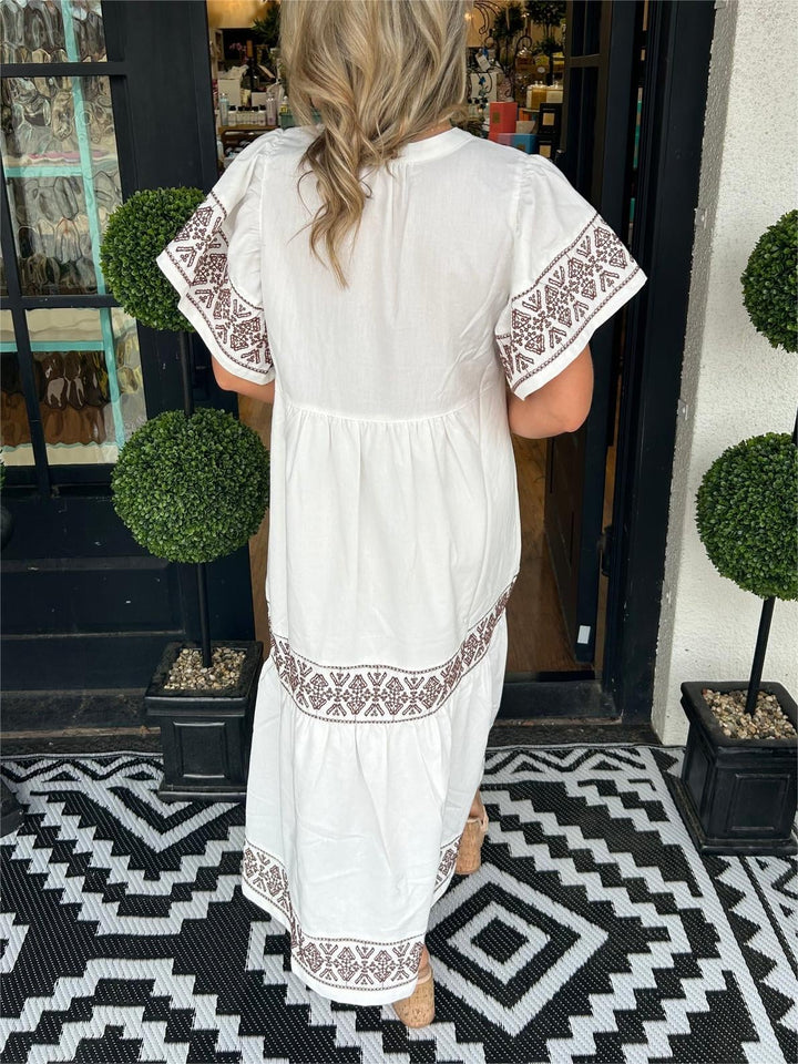 Flat lay of the Cassandra boho flowy dress showing fabric texture and color options