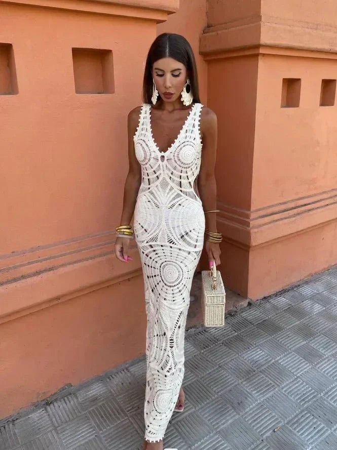 Woman wearing a white wrap dress with a flowing, figure-flattering silhouette for a wedding guest occasion