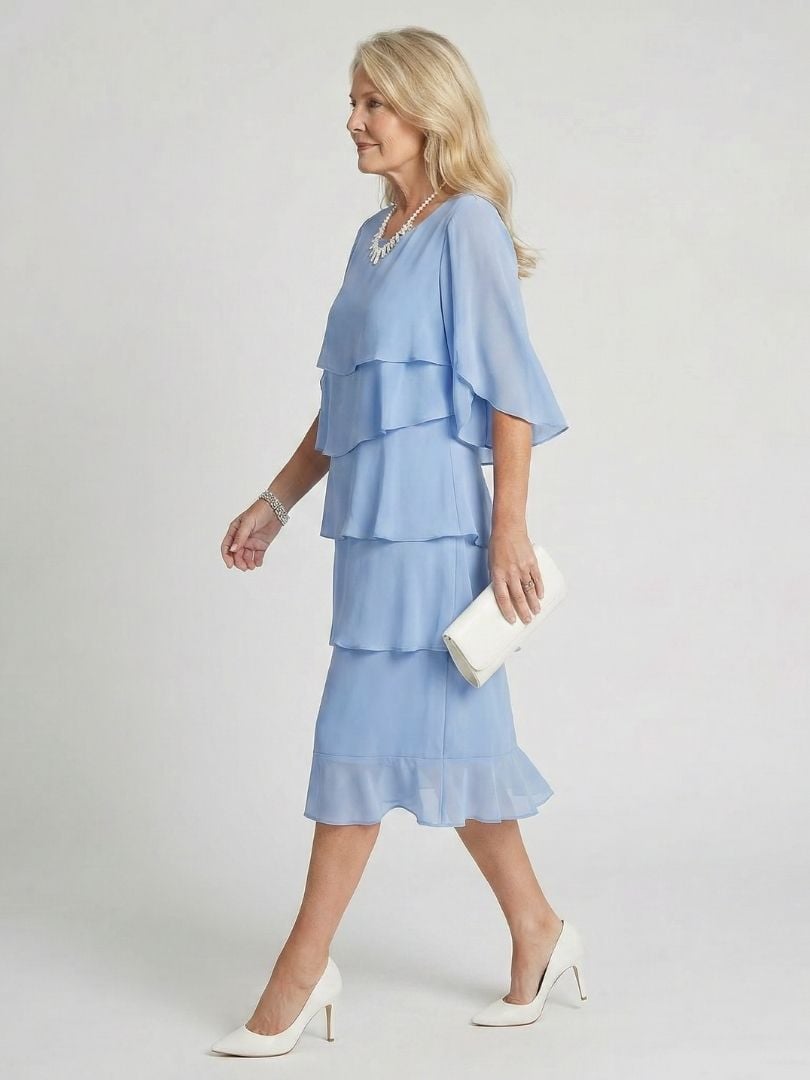 Front view of light blue flutter sleeve midi dress with tiered skirt and round neckline