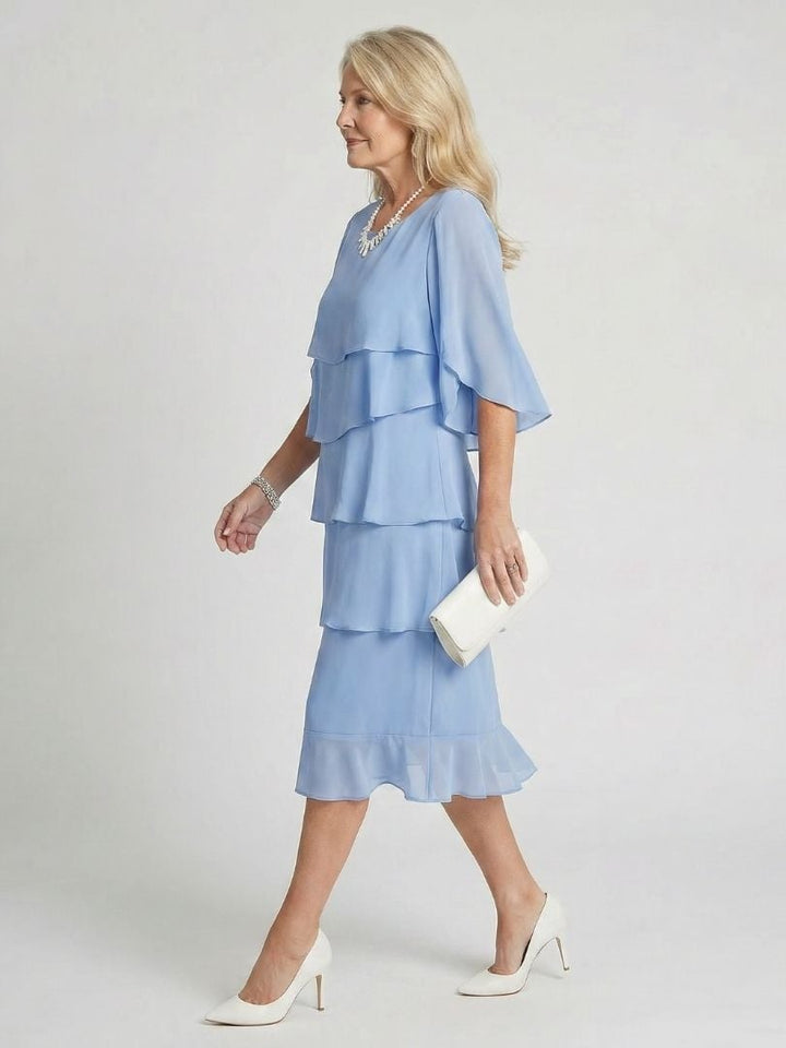 Front view of light blue flutter sleeve midi dress with tiered skirt and round neckline