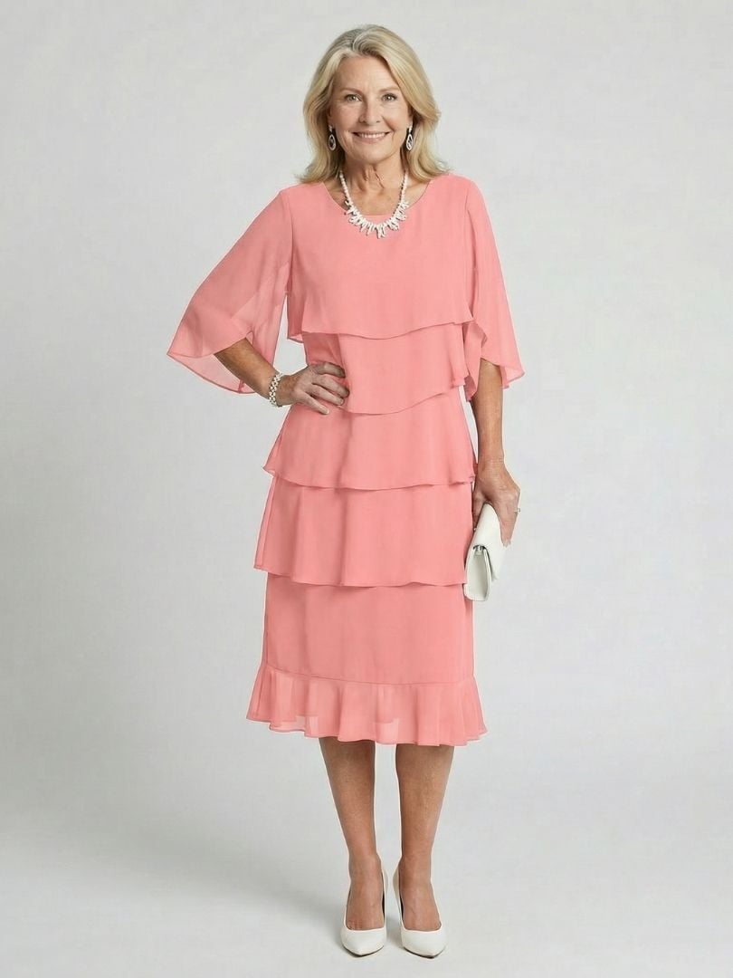 Front view of white tiered midi dress with flutter sleeves and classic round neckline