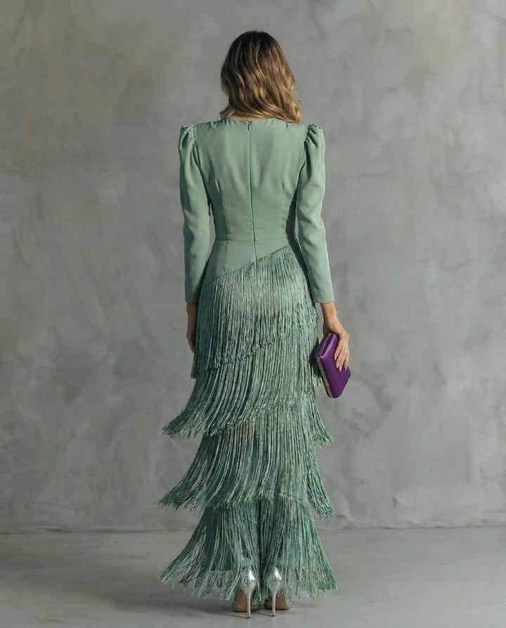 Close-up of tiered fringe detailing on the Cassiopeia maxi dress in green