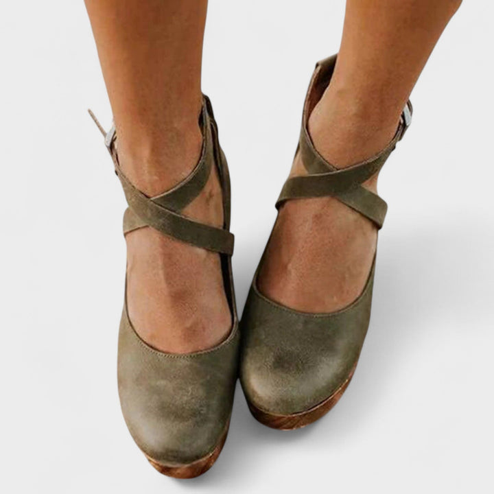 Catalina flat sandal in brown displayed on a neutral background