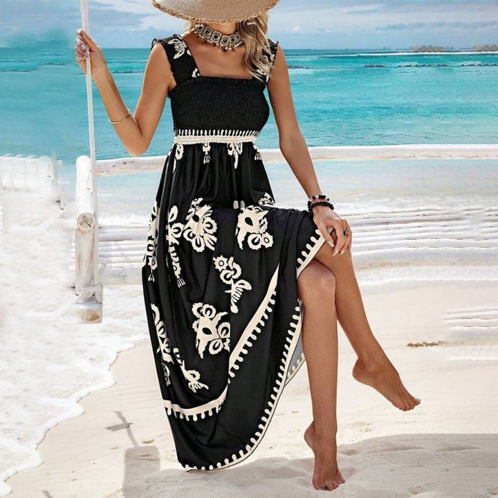 Side profile of the Catalina printed flowy dress in black highlighting the relaxed silhouette