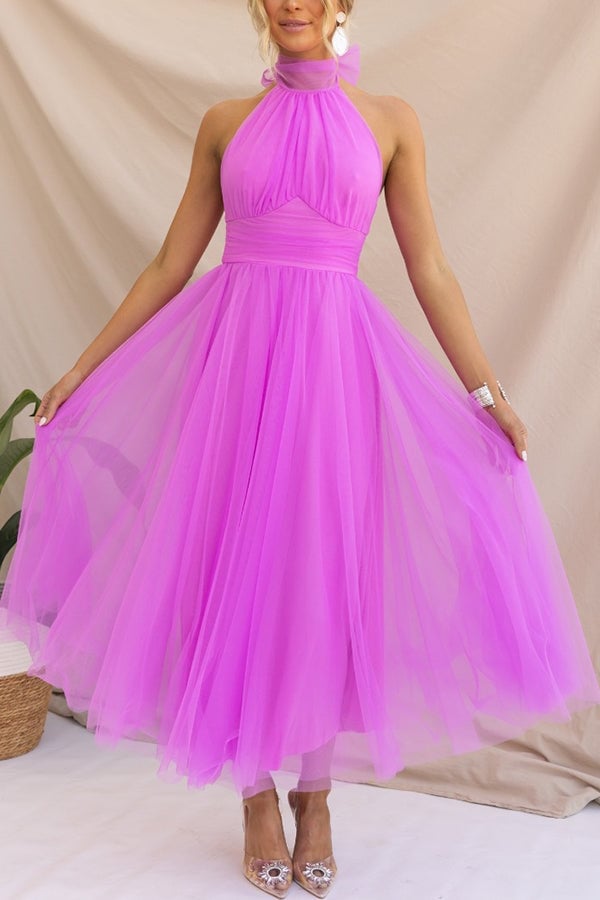 Front view of the Catalina women's tulle wedding guest dress in dark pink with flowing layered skirt