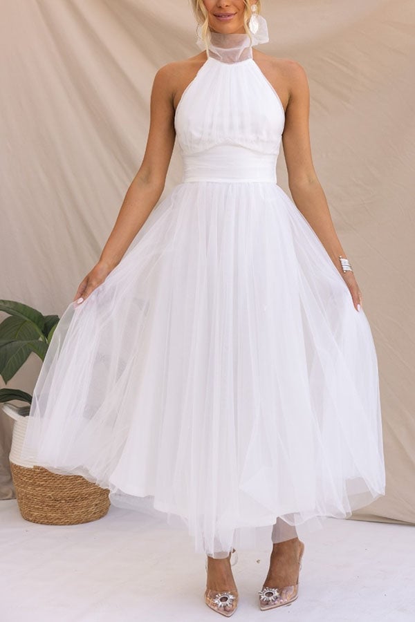 Full-length front view of the Catalina dress in pink with soft volume and flattering waistline