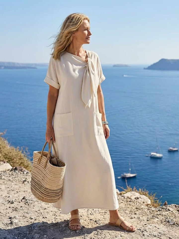 Close-up of the round neckline and tie detail on the Catalina maxi dress