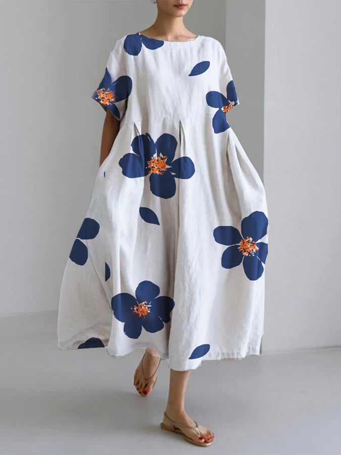 Front view of the Caterina maxi dress showing bold floral pattern and relaxed fit in blue colorway