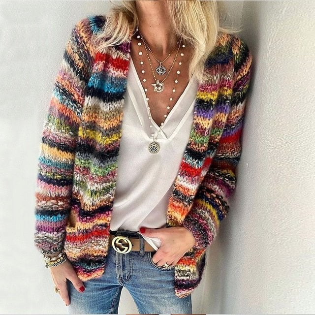 Woman wearing a cozy multicolor cardigan in a relaxed fit, shown in rich fall tones