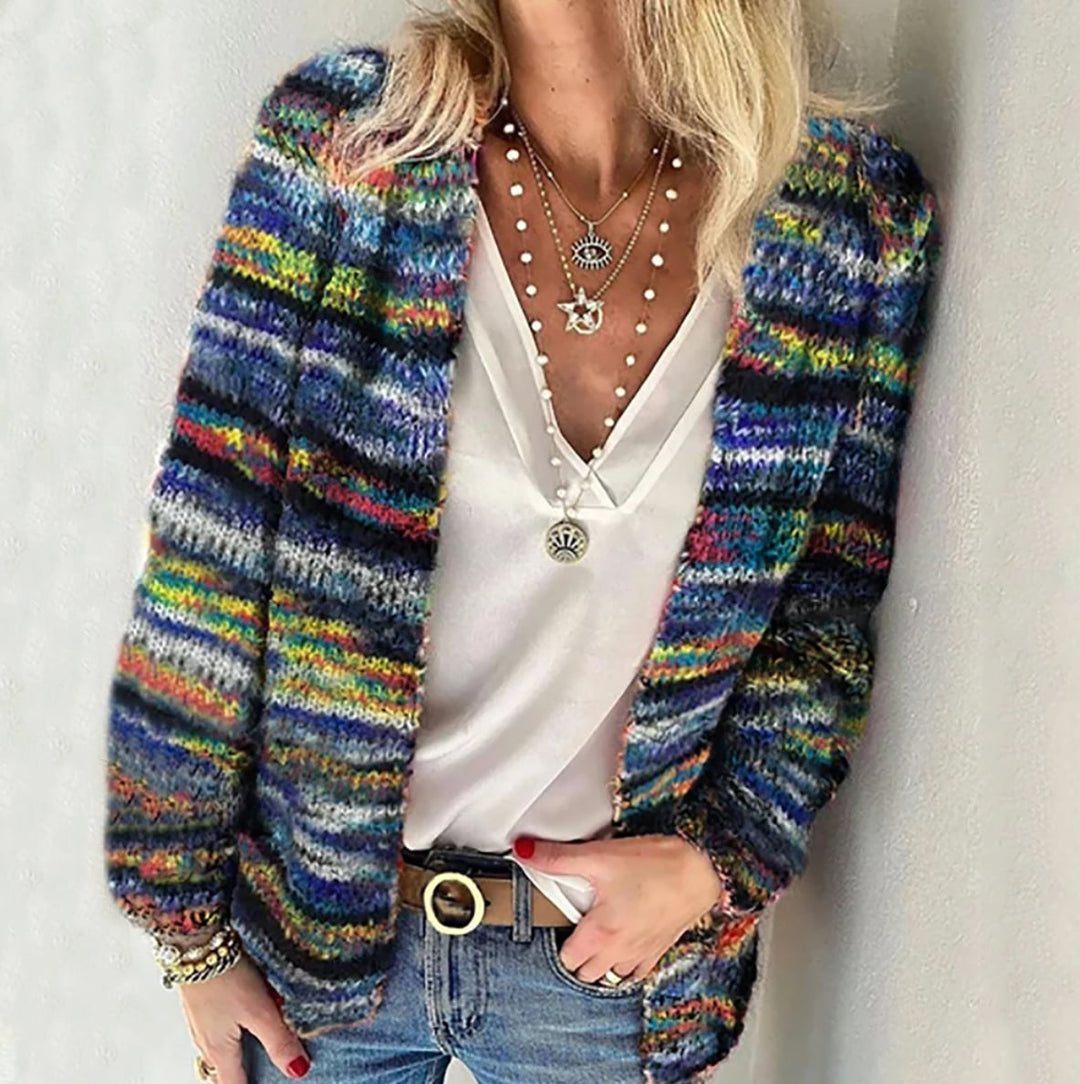 Close-up front view of a soft multicolor open-front cardigan in vibrant autumn colors