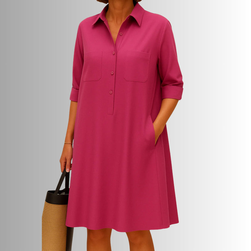 Side view of the flattering A-line silhouette of the lightweight button dress in dark blue