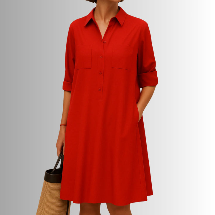 Woman wearing the lightweight button dress with sandals for a casual summer look in blue