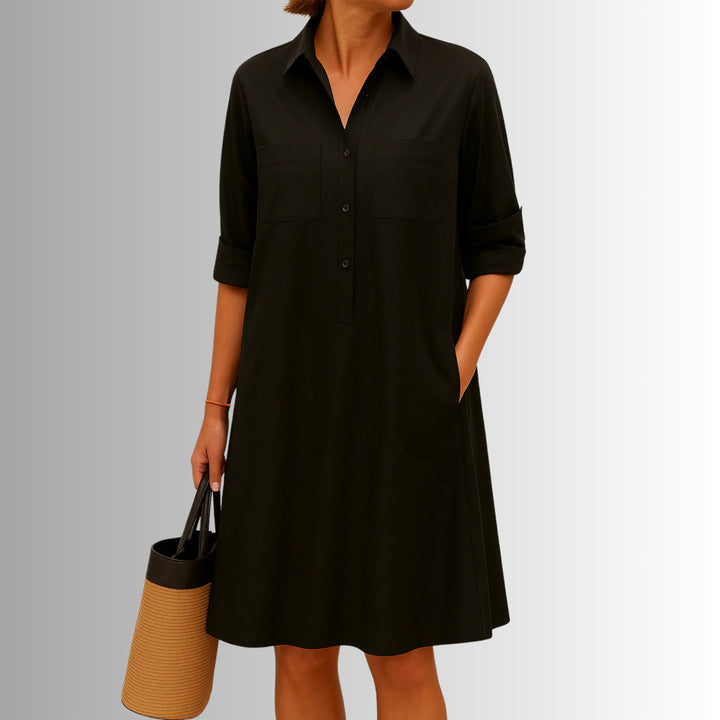Full-length view of the lightweight button dress highlighting the flared hemline and side pockets in red