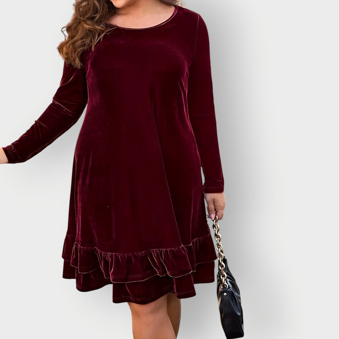 Model wearing the Celeste Classic Midi Dress in violet, styled casually with flats
