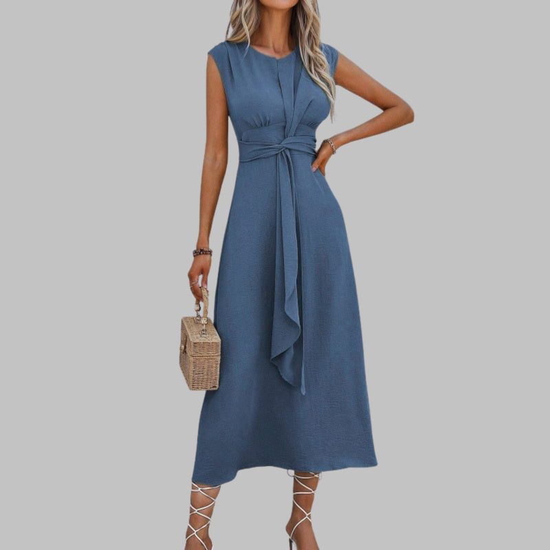 Close-up of the self-tie sash belt and round neckline on the Celeste midi dress