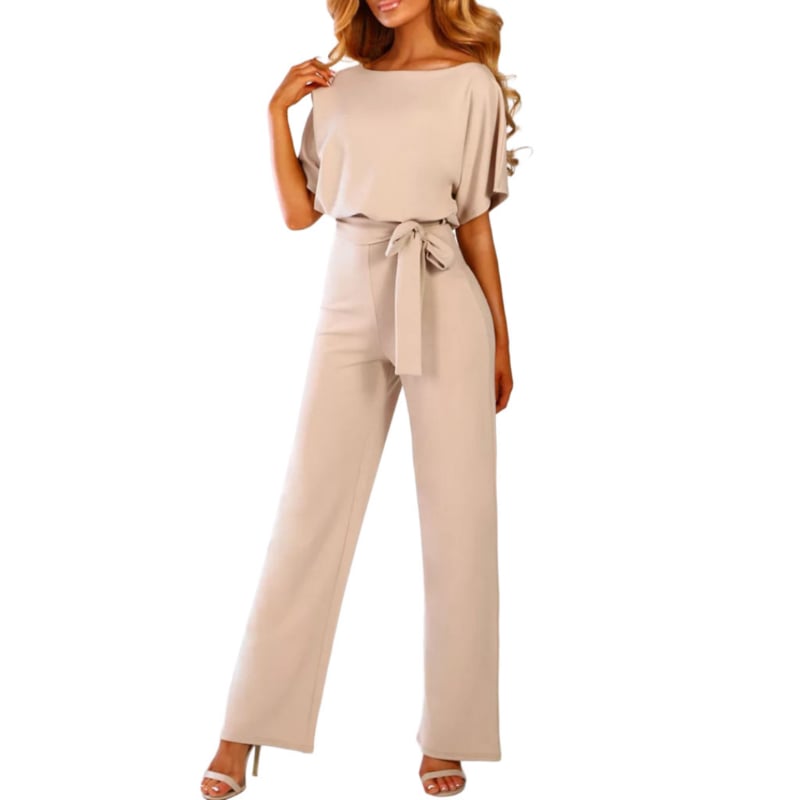 Side profile of the Celeste belted jumpsuit in yellow highlighting the flowing wide-leg silhouette