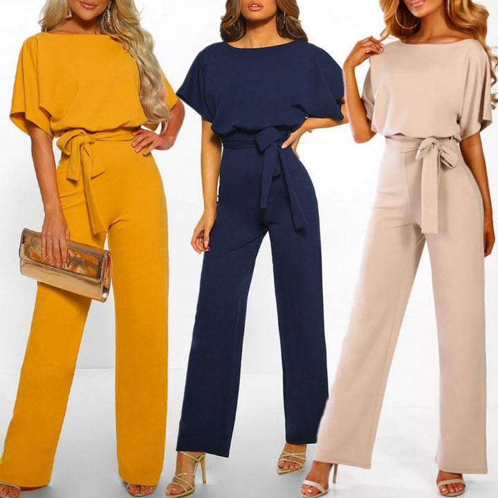 Close-up of the self-tie fabric waist belt on the Celeste jumpsuit in yellow