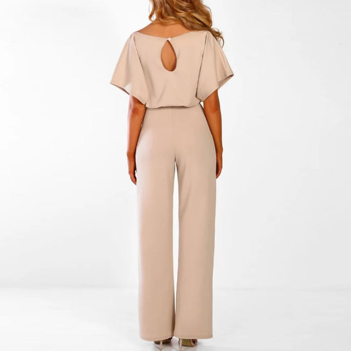 Detail shot of the batwing sleeve drape on the Celeste jumpsuit in beige