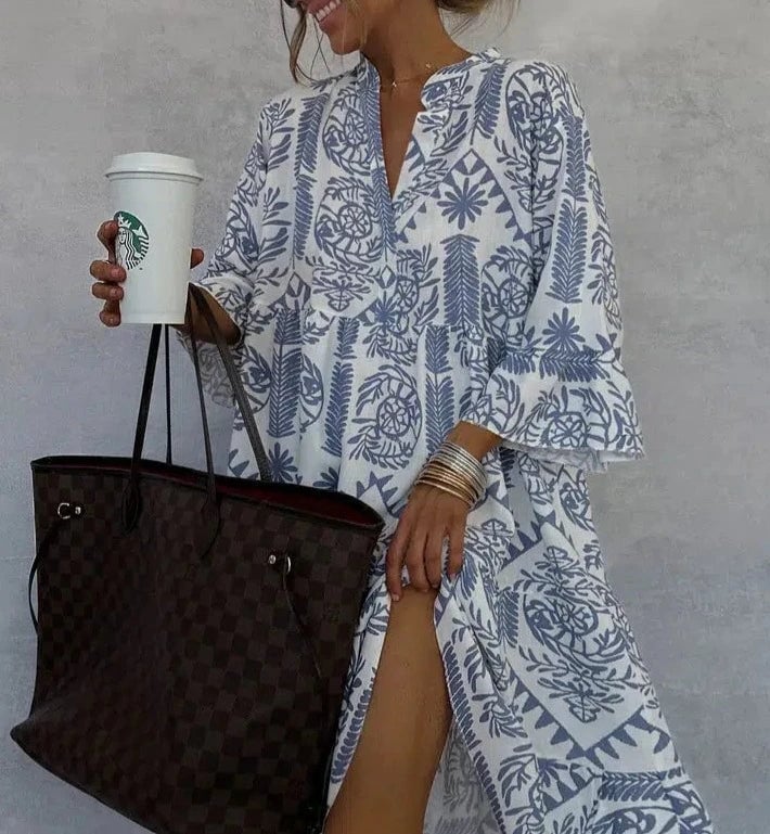 Side view of the Celeste boho swing dress showing the flowing tiered skirt and button-detail V-neckline in blue tile print