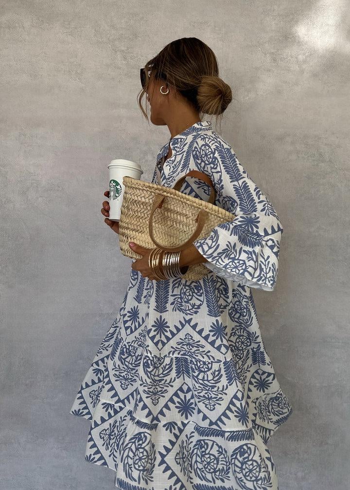 Back view of the Celeste women's boho print swing dress in blue and white with 3/4 sleeves