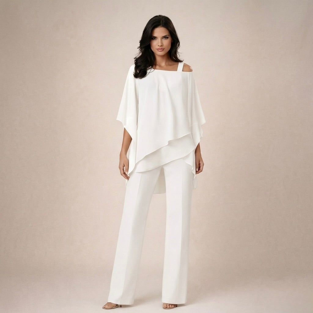 Woman wearing the Celeste white off shoulder bardot top and wide leg pants set against a neutral background