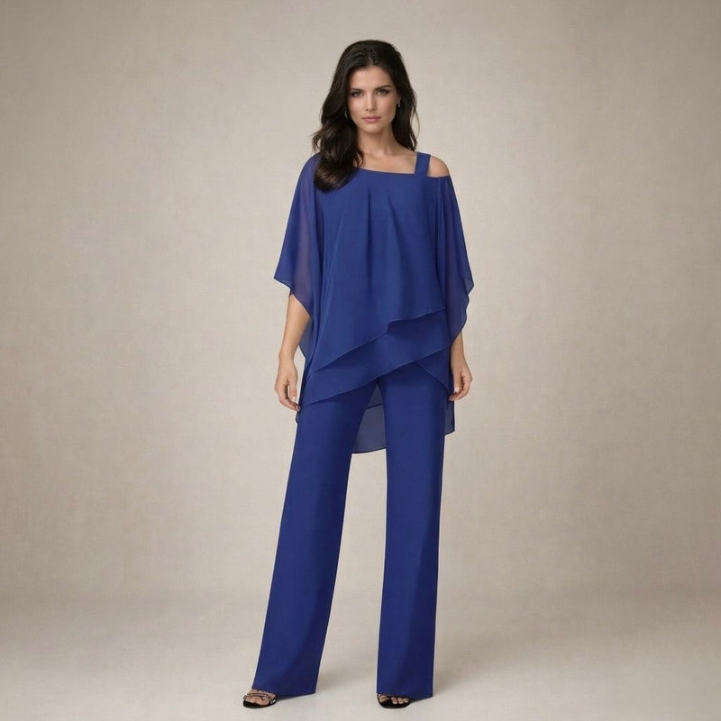 Close-up of the Celeste set's off shoulder neckline and asymmetric layered drape in navy