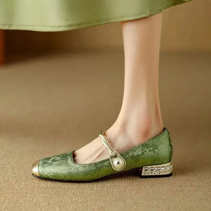 Celeste pearl strap mary jane shoes in sage green, side profile showing glitter heel and pearl-embellished strap