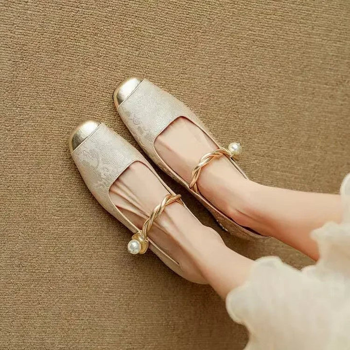 Celeste beige mary jane heels, side profile showing pearl-embellished strap and glitter block heel