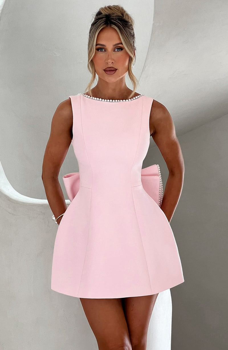 Front view of the Celeste pearl trim sleeveless A-line mini dress in pink showing the bateau neckline detail