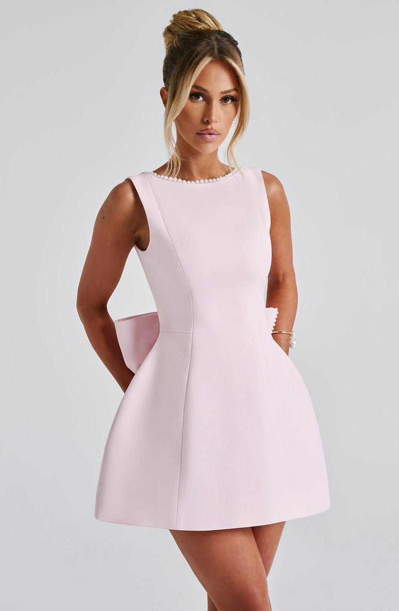 Full-length front view of Celeste mini dress in black showing the structured A-line silhouette
