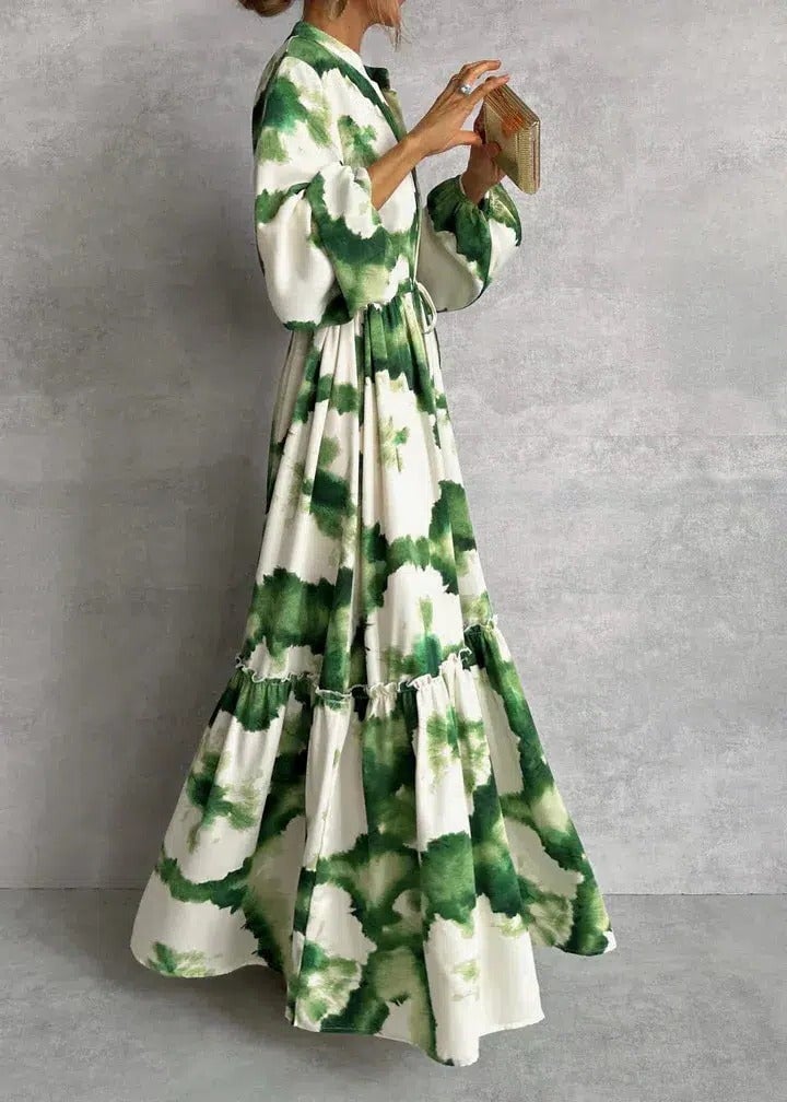 Close-up of the self-tie waist belt and tiered ruffle skirt on a green tie-dye maxi dress