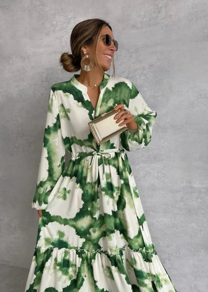 Back view of the Celeste green tie-dye maxi dress showing billowy long sleeves and full-length silhouette