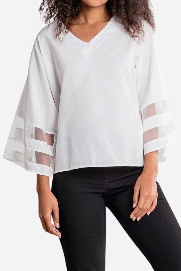 Front view of the Celeste white v-neck bell sleeve blouse with sheer mesh panel inserts on the flared 3/4 sleeves