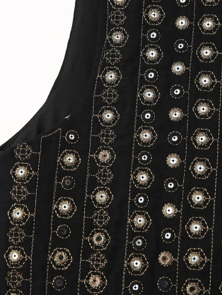 Flat lay of black sequin boho vest displaying full embroidery pattern