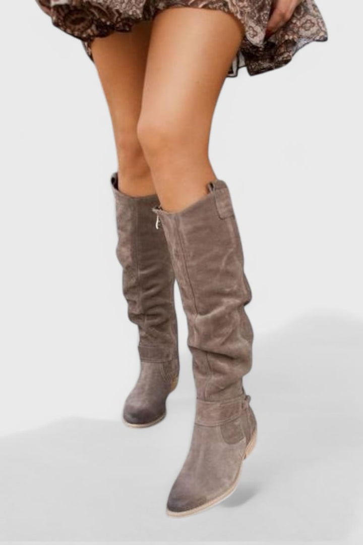 Apricot-colored retro high boots displayed against a neutral background