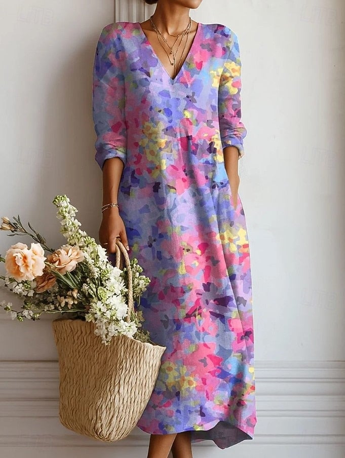 Women's floral V-neck long sleeve midi dress in purple with vibrant abstract print, front view