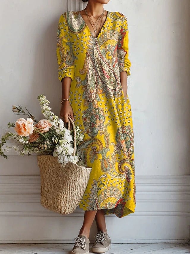 Women's floral midi dress in yellow with V-neckline and long sleeves, front view