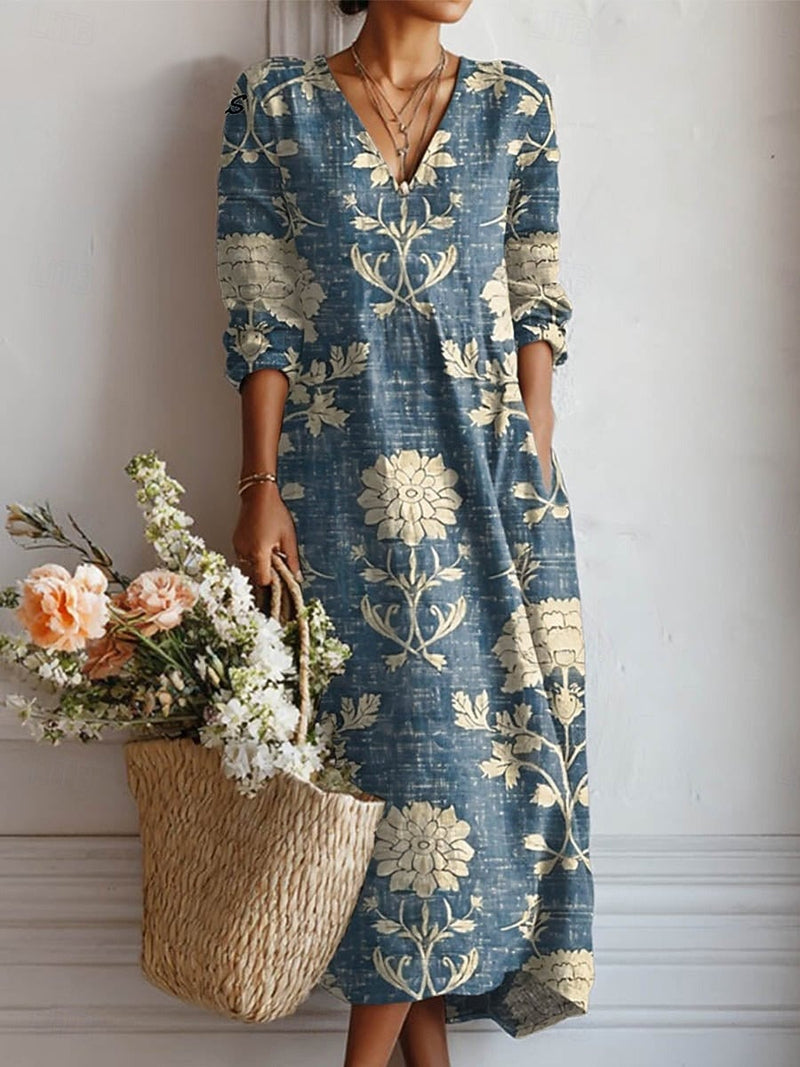Women's floral long sleeve midi dress in blue, showing relaxed fit and midi length