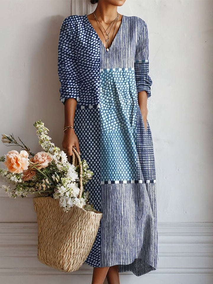 Women's floral V-neck midi dress in light blue, full-length front view showing overall silhouette