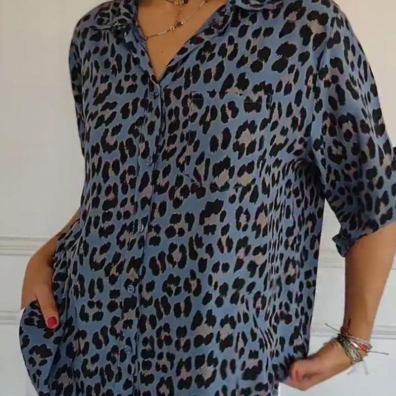 Front view of a blue leopard print blouse with tie-front detail and relaxed silhouette