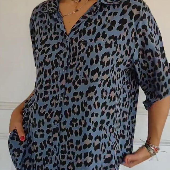 Front view of a blue leopard print blouse with tie-front detail and relaxed silhouette