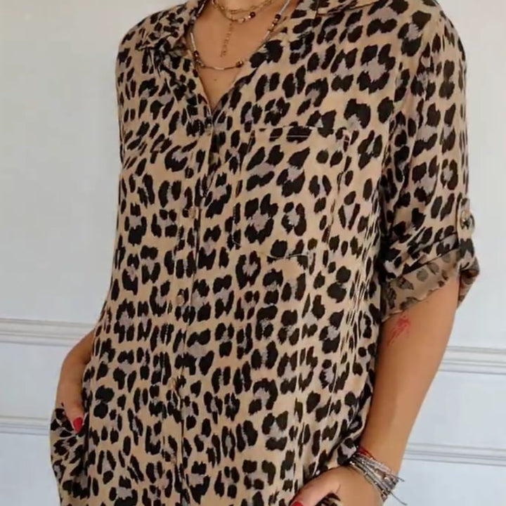 Close-up of leopard print fabric and tie-front knot detail on a women's blouse