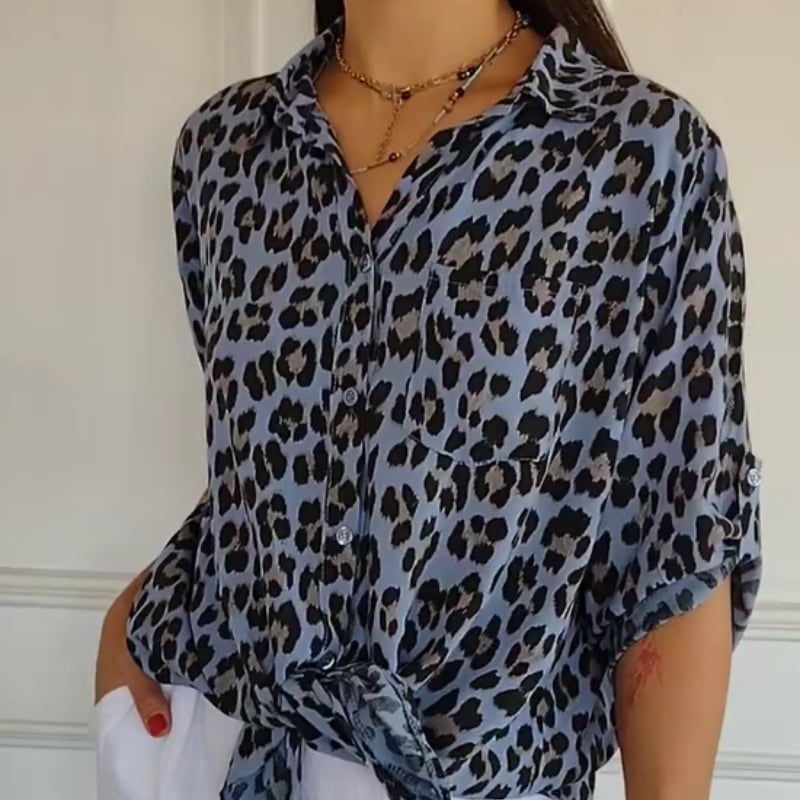 Purple leopard print tie-front blouse shown on a model highlighting the flattering drape